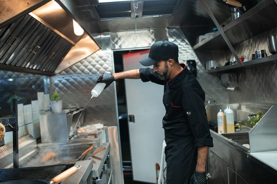 Family members working in the truck's kitchen